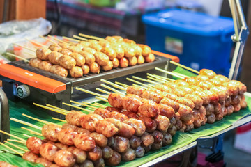 Thai style street food variety of grilled e-san sausage.
