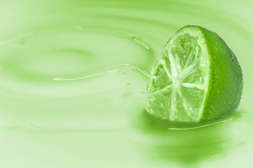 Lime immersed in a light green liquid with the consistency of milk