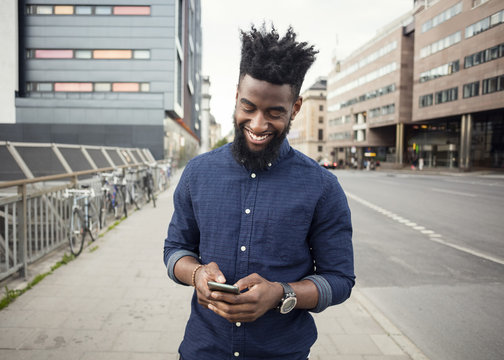 Man In Street Using Smartphone