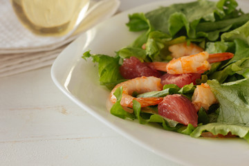 Salad with shrimps and grapefruit top view