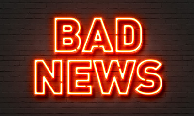Fototapeta na wymiar Bad news neon sign on brick wall background.