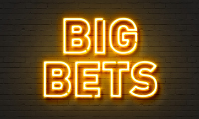 Big bets neon sign on brick wall background.