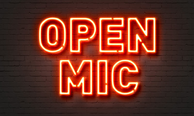 Naklejka na ściany i meble Open mic neon sign on brick wall background.