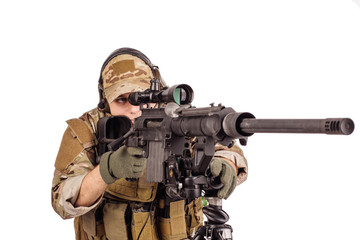 Portrait soldier or private military contractor holding sniper rifle.