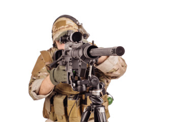 Portrait soldier or private military contractor holding sniper rifle.