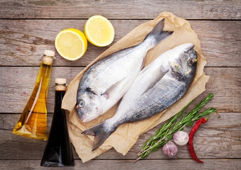 Fresh dorado fish cooking with spices and condiments