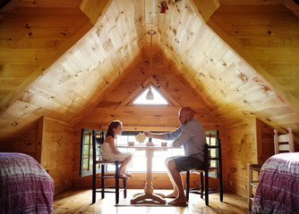 Father and daughter (6-7) having tea party