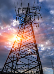  high-voltage  power lines at sunset.