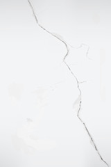 Cracks in the old whitewashed wall