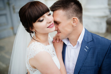 Wedding. Wedding day. Close-up of couple. Beautiful bride and elegant groom walking after wedding ceremony. Bride and groom at wedding day.