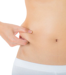 Woman checks and pinching Excess fat on her flank seems like to be fat, overweight concept, Isolated on white background.