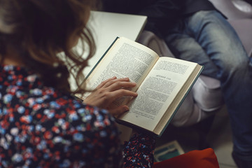 girl reading a book a young man
