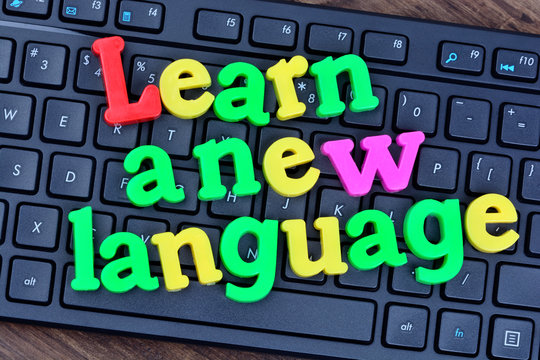 Learn a new language words on computer keyboard