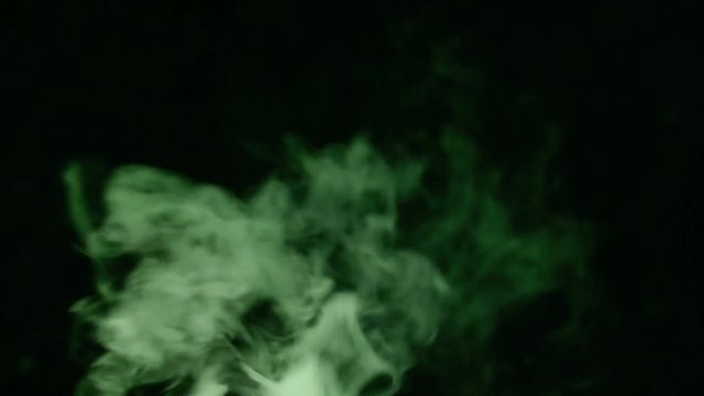 green smoke waves on dark background