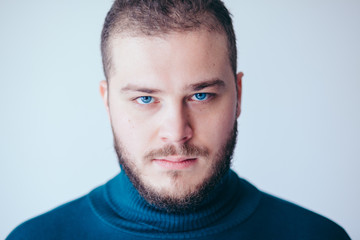 Fototapeta premium Portrait of a handsome bearded young man