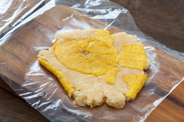 Ajiaco Preparation: Raw smashed piece of plantain called patacon