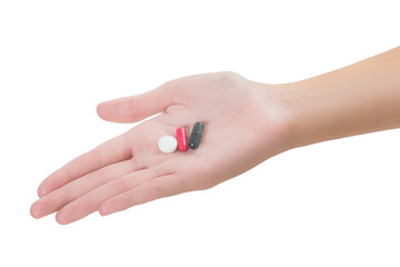 Closeup woman hand hold pills and medicine isolated on white background