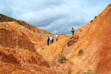 group of tourists in canyon  fairy tale, Kyrgyzstan, Issyk-Kul