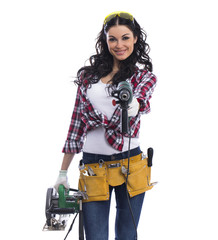 Sexy brunette woman mechanic with circular saw and perforator