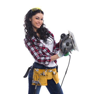 Sexy brunette woman mechanic with circular saw