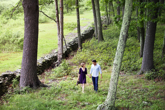 Couple Walking Through Woods