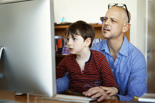 Father and son surfing net