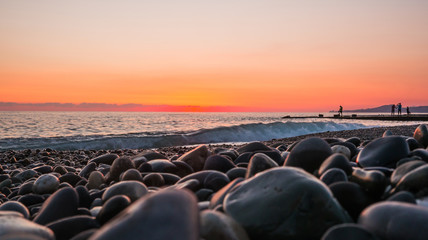 Fototapeta premium sunset on the beach. Shore of the Black Sea in Sochi, Russia