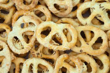 Salted pretzels with cumin and sesame. Typical party or holiday treat. Typical tasty european delicacy.