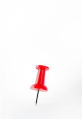 Close up red push pin isolated on white background