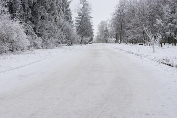 Snowy street of small village in central Ukraine at winter season