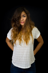 Portrait of beautiful long haired young girl in low key