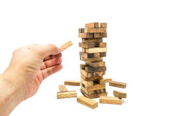 a man Use your hand playing a stacking Tower game