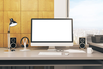 Desk with blank white computer