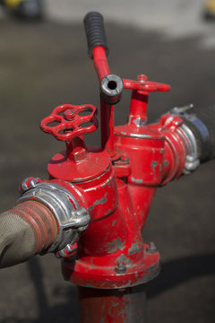 red metallic fire hydrant or Fire Department Connection on street 