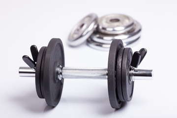 Fototapeta na wymiar Dumbbell and barbell discs for workout
