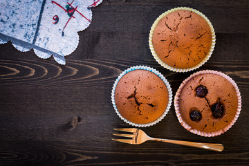 Obraz na płótnie Canvas Chocolate muffins in dark background