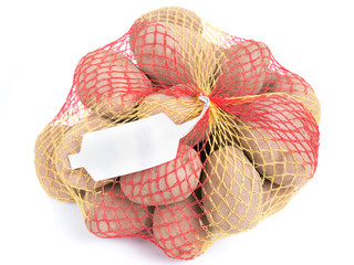 Ripe potatoes in string bag