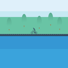 Cyclist riding bicycle near the lake in spring landscape. Healthy active sport lifestyle. © jozefmicic