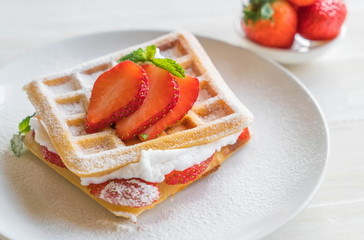waffle with strawberry on wood