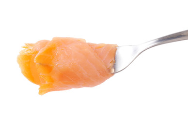 Smoked salmon slice on fork