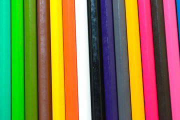 Close up of color pencils over black background