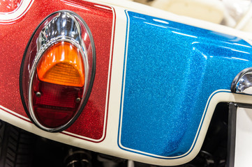 Back of a red, blue and white sport car
