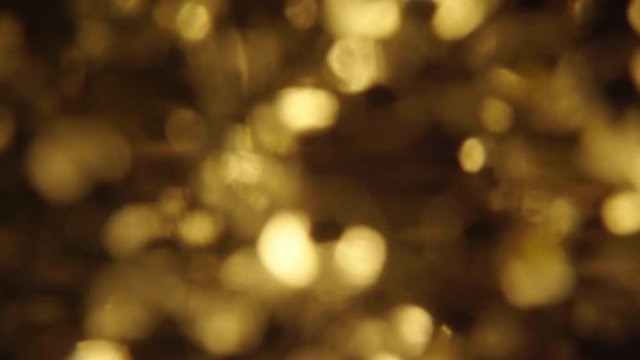 gold sparkle background with optical blurred effect - medium