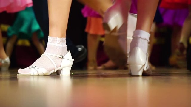 Background - children's tournament on ballroom dances - feet on the floor