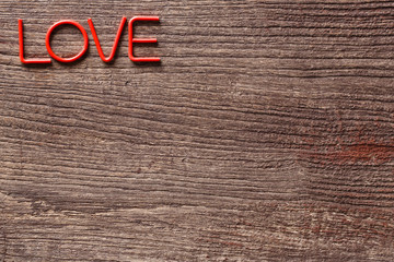 Love alphebet on wooden background