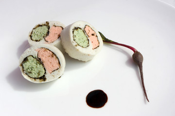 Sea sushi filled with salmon, colored rice, laminaria and a small beet