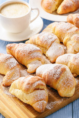 Homemade sweet croissants stuffed with cheese.