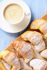 Homemade sweet croissants stuffed with cheese.