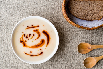 Turkish Soup Dugun Corbasi with fried butter sauce and bran bread