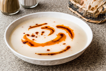 Turkish Soup Dugun Corbasi with fried butter sauce and crispy bread